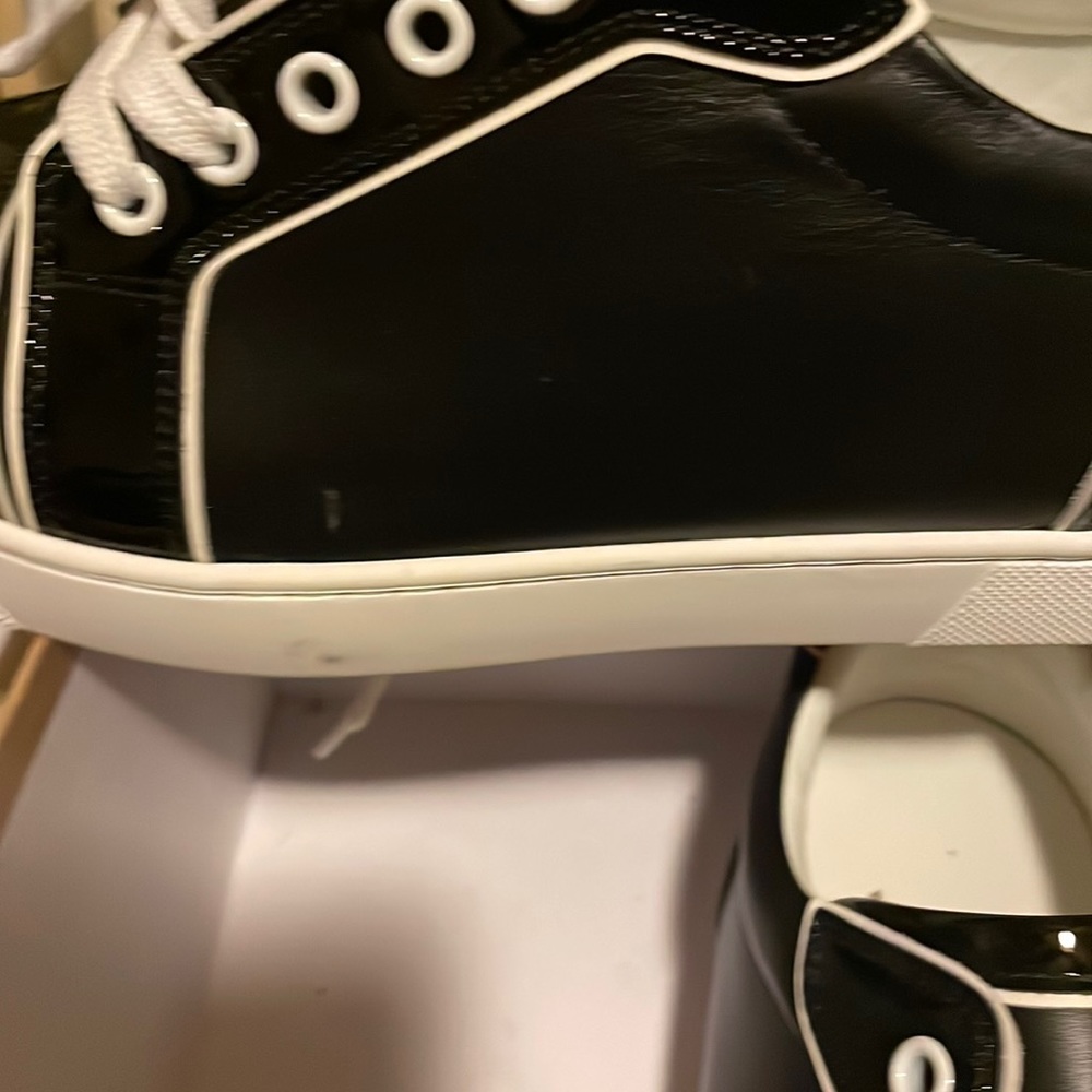 Brand  new Christian loubotin red bottom sneak shoe, size US 9, or size 40